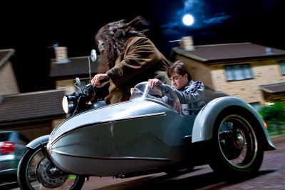 Everyone mounts up and leaves Privet Drive. Harry and Hagrid take the bike.
